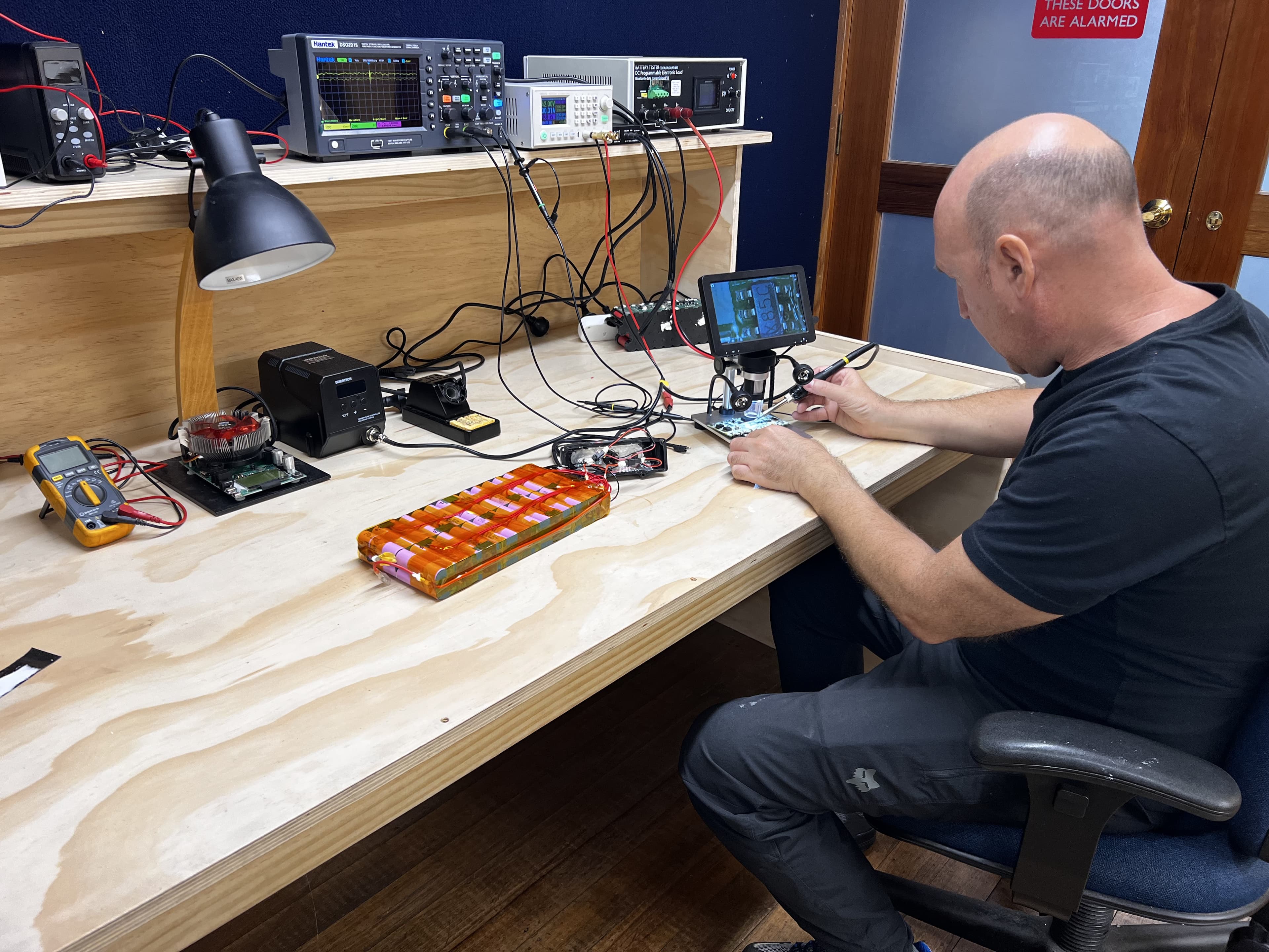 Technician assessing e-bike battery